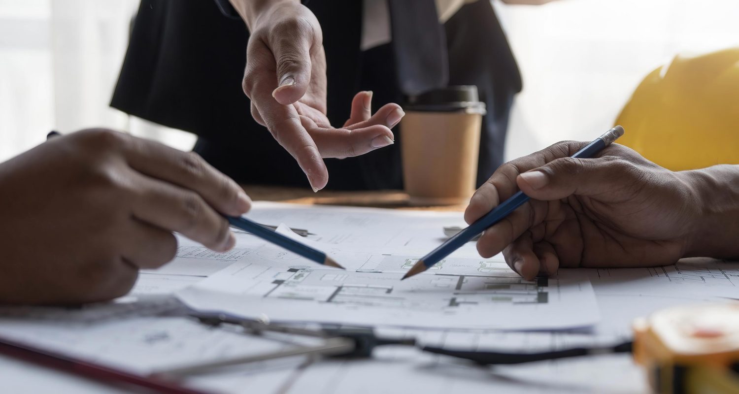 hands working on plans